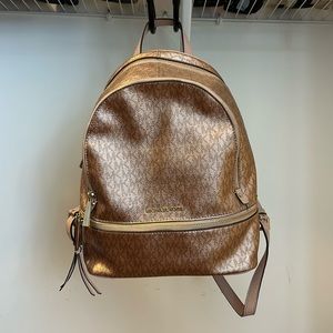 Rose gold Michael kors backpack